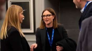 Attendees chatting at iab event